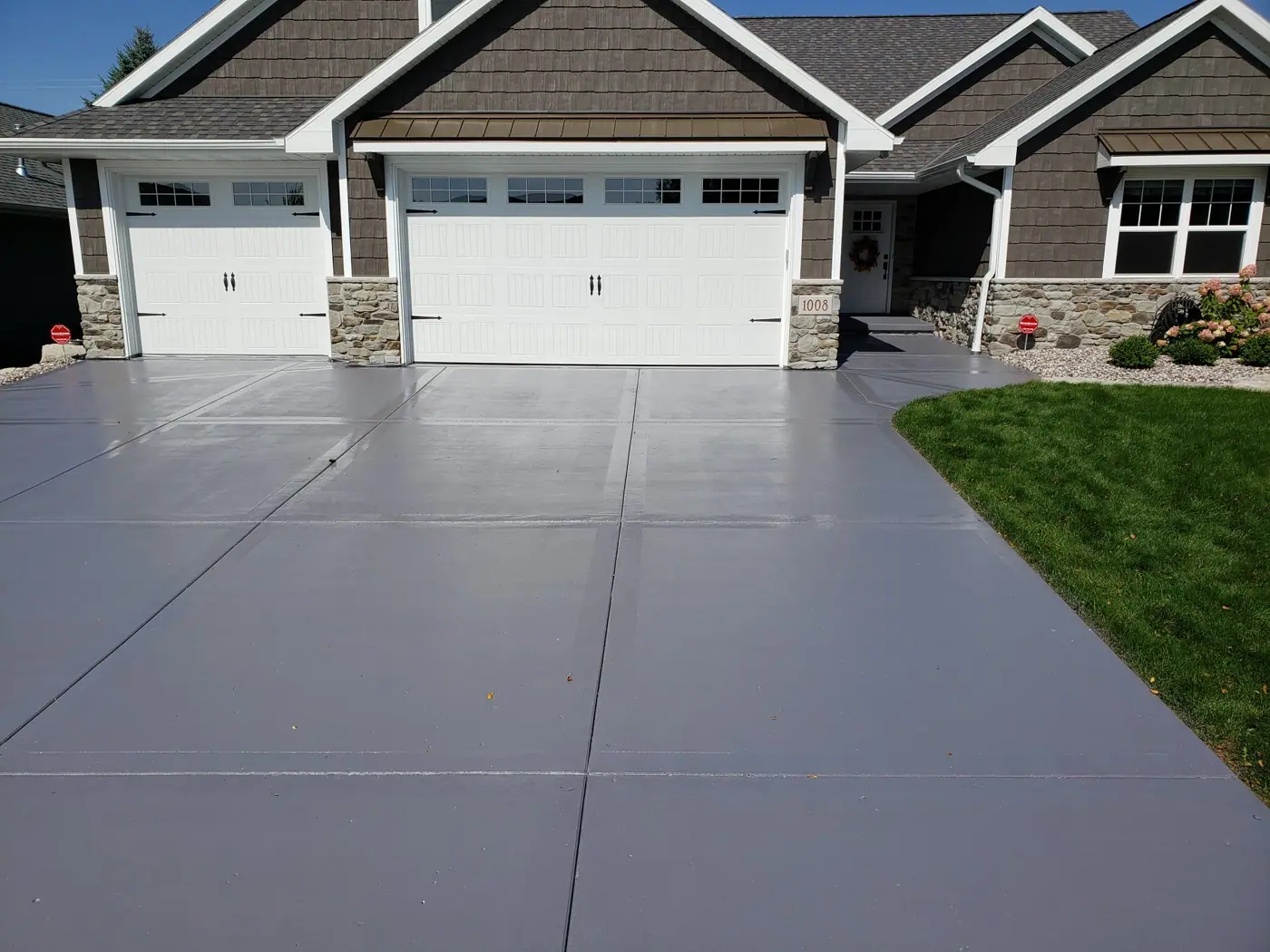Same driveway after concrete restoration and resurfacing